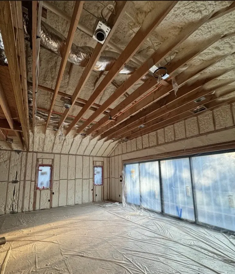 Interior walls and ceiling insulated with spray foam during new construction in Winfield